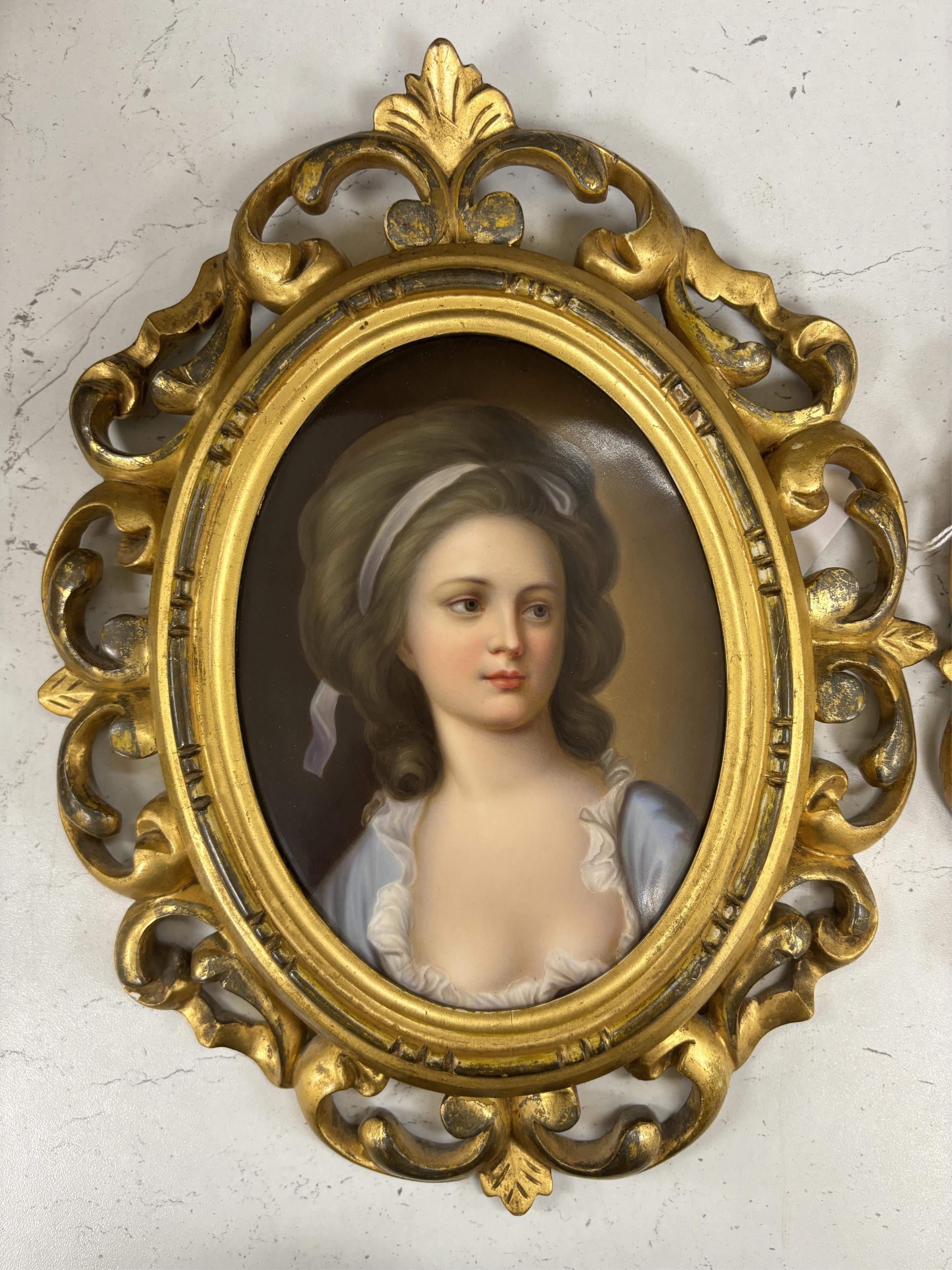 A pair of Continental oval porcelain plaques hand painted with female portraits, housed in Florentine giltwood frames (2)